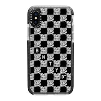 a black and white phone case with a checkered pattern