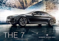 the bmw 7 series is shown in a dark room