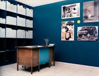 a room with a lot of pictures on the wall