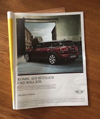 a magazine with a picture of a mini cooper