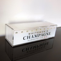 a clear box with a bottle of champagne on it